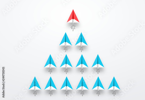 Group of paper planes in one direction, Red paper plane is leader. Leadership, teamwork and courage concept