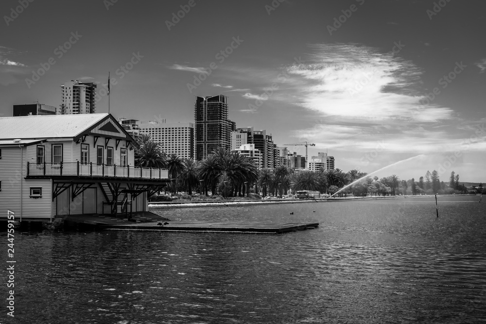 Naklejka premium Perth seen from Elizabeth key including house of West Australian Rowing Club and fire brigade practicing in black and white