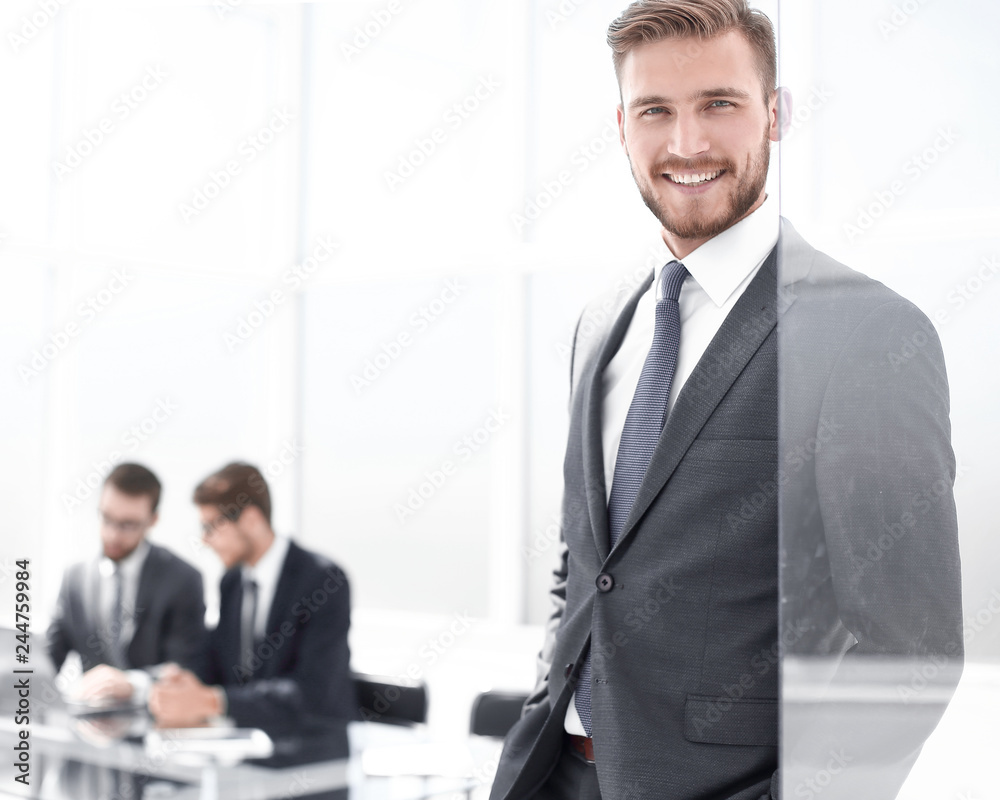 modern businessman on the background of the office modern businessman on the background of the office