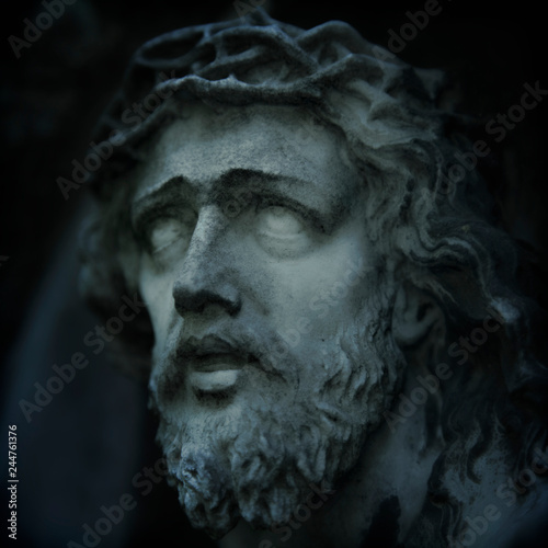 Marble antique statue of suffering of Jesus Christ crown of thorns. Religion, faith, death, resurrection and eternity concept.