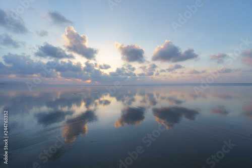 Seascape with clouds reflections on beach © mimadeo