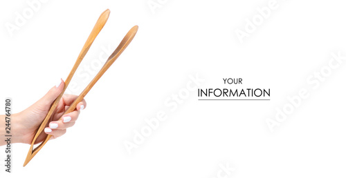 Wooden kitchen tongs in a hand pattern on a white background isolation