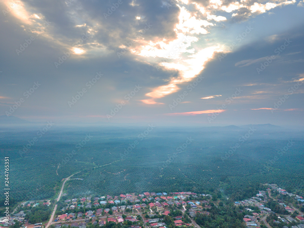 Aerial view of countryside with sunset background.