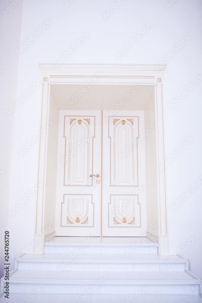 white wooden doors with baguettes