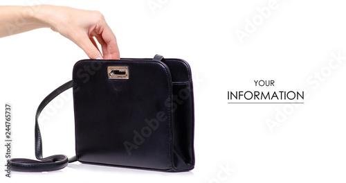 Female black leather bag in hand pattern on white background isolation
