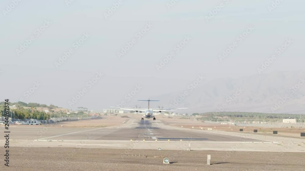 Small propeller passengers airplane landing to airport Small propeller passengers airplane landing to airport