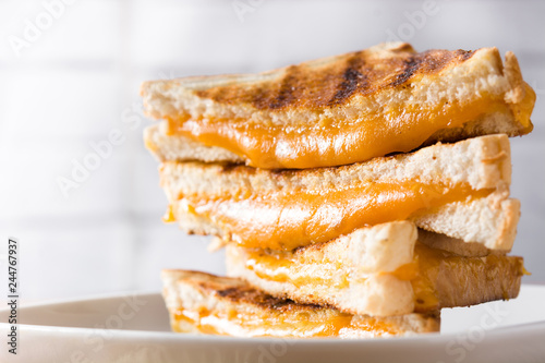 Grilled cheese sandwich on wooden table. Close up