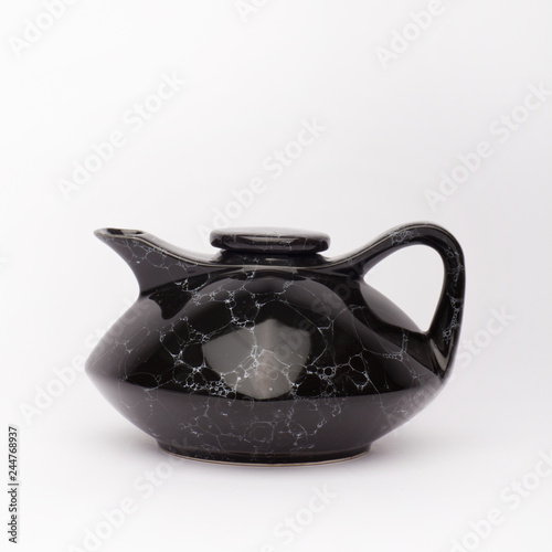 Japanese black teapot on the white background photo