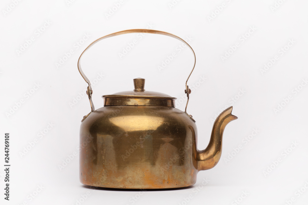 Old brass teapot on the white background Old brass teapot on the white background