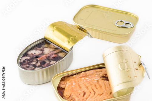 Open canned fish. Smocked salmon filets and calamari. photo