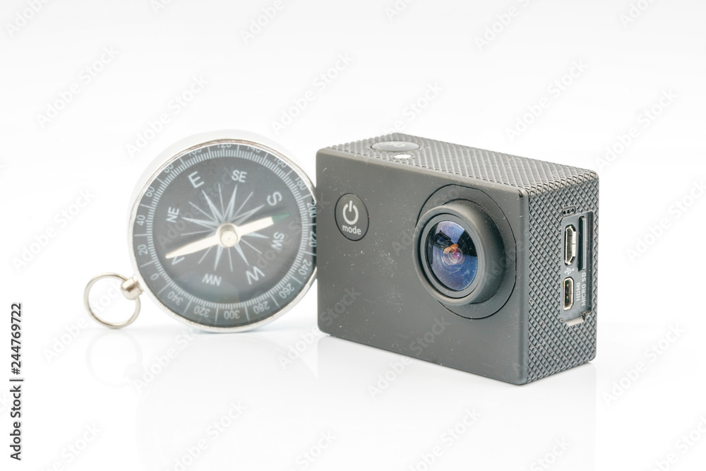 Action camera and compass with travell concept. Action camera and compass with travell concept.