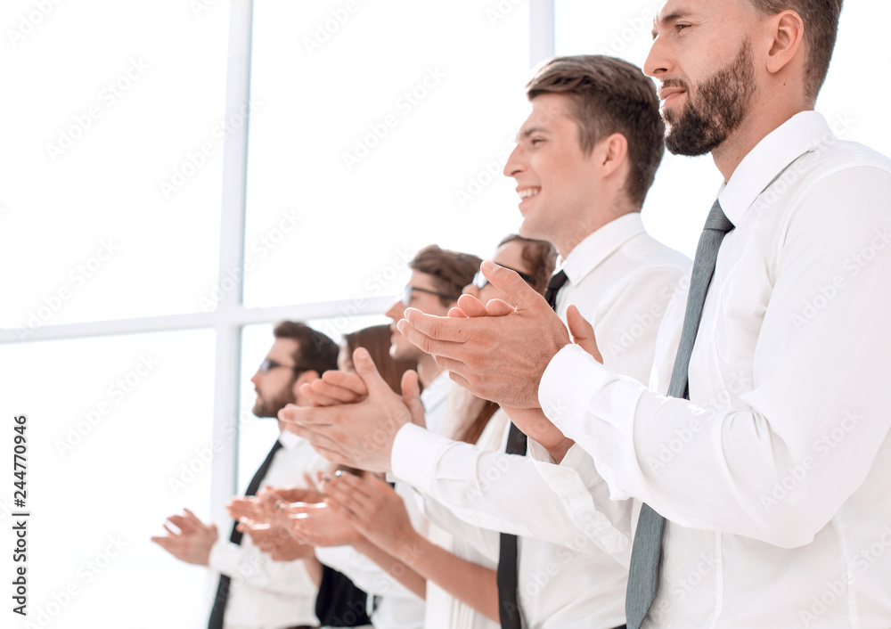 Fototapeta premium close up.smiling business team applauds standing
