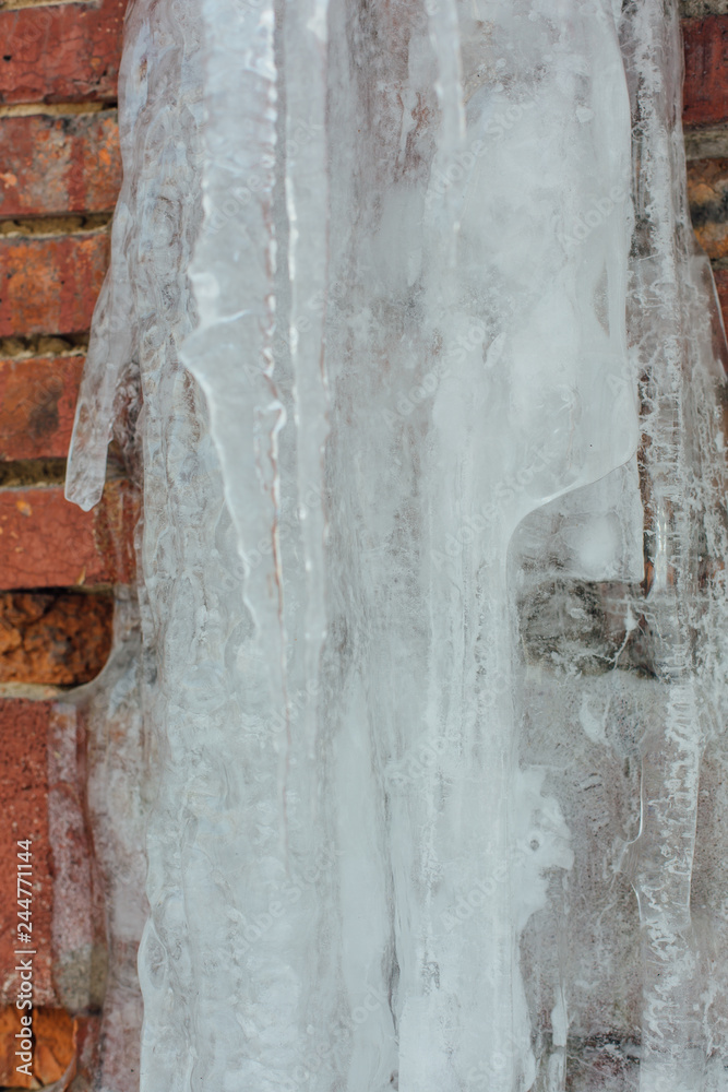 Very large and dangerous icicles in close up