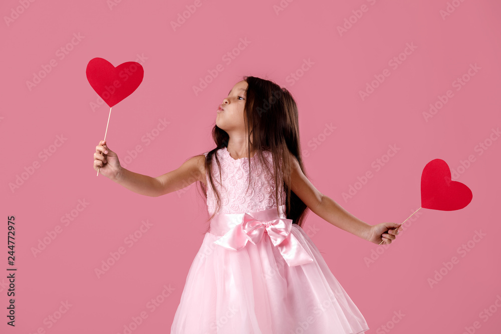 cute little girl in a pink dress holding a paper heart cute little girl in a pink dress holding a paper heart