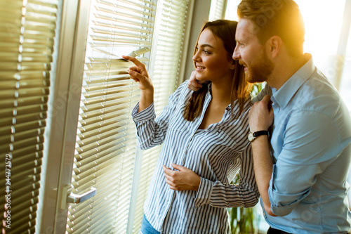 Young couple by the window