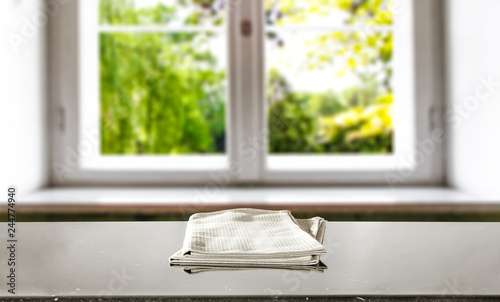 Table background with napkin and window of spring time 