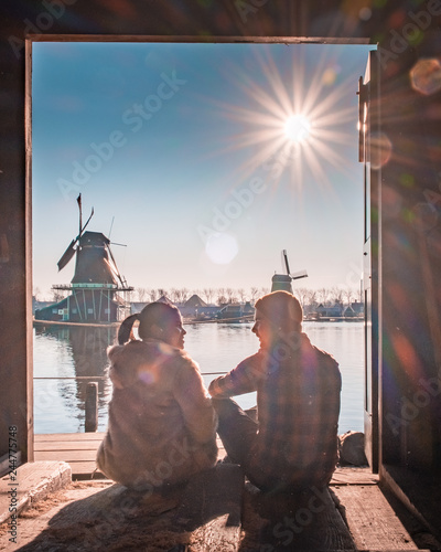 Photography young couple relaxing at the windmill village Zaanse Schans netherlands Dutch wi