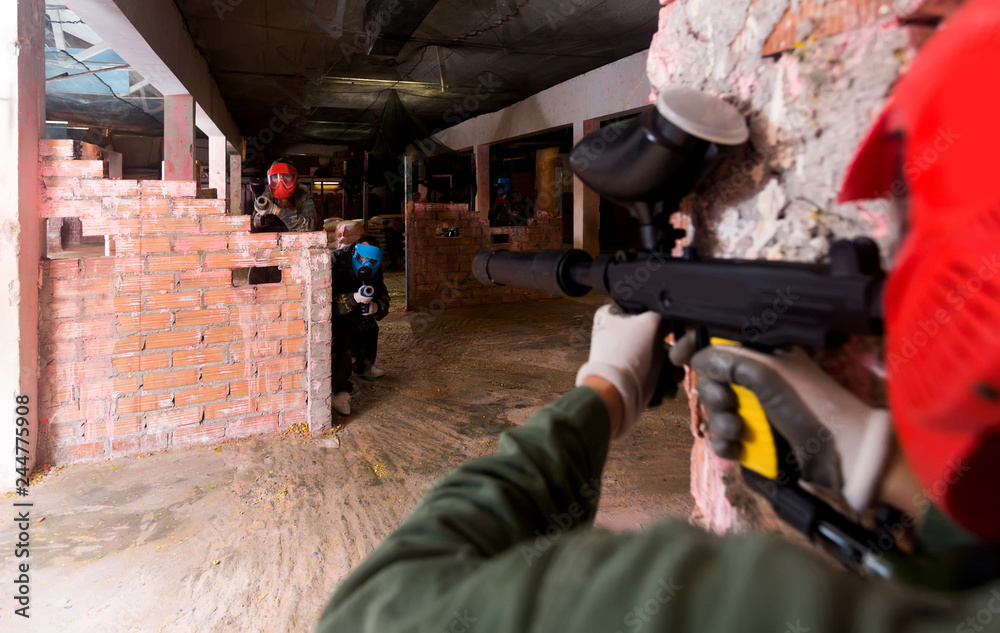 Fototapeta premium Players are targeting in opponents from cover in battlefield.