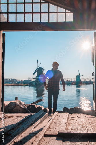 Canvas Print young men at the windmill village Zaanse Schans Netherlands