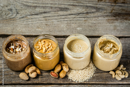 Bild auf Leinwand Selection of nut butters - peanut, cashew, almond and sesame seeds, copy space