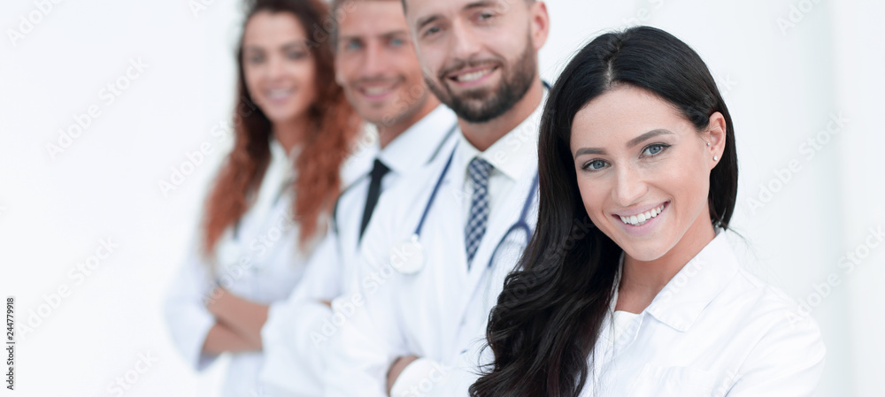 woman doctor on the background of colleagues woman doctor on the background of colleagues