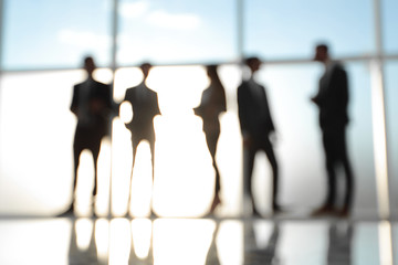 Silhouettes of Business People in Office. Mixed media .