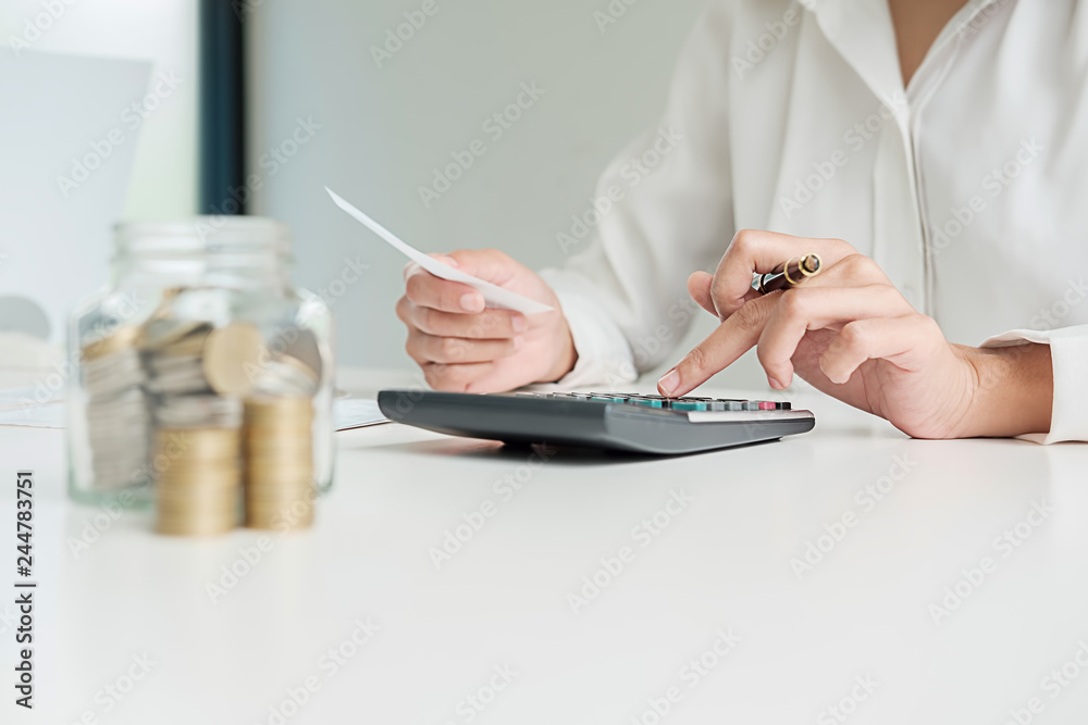 Fototapeta premium Rows of coins for finance and banking concept with business man and woman. A metaphor of international financial consulting.