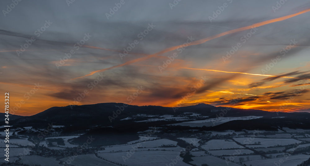 Sunrise on Boren hill near Bilina town in winter frosty morning