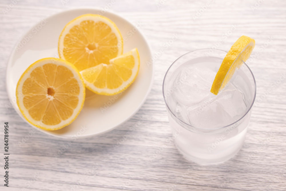 Refreshing cold water with lemon. With ice. Ready to eat. Next is a knife after cutting fruit. Misted glass. Refreshing cold water with lemon. With ice. Ready to eat. Next is a knife after cutting fruit. Misted glass.