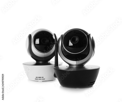 Modern CCTV security cameras on white background