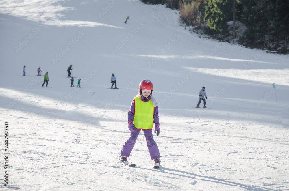 child learning to ski