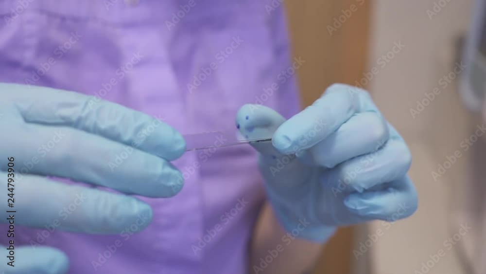 doctor microbiologist using microscope and doing urine analysis in the laboratory. doctor microbiologist using microscope and doing urine analysis in the laboratory.
