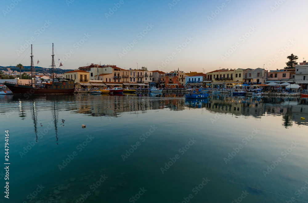 Greece, Crete Rethymno, panoramic view old venetian harbor at the sunset.