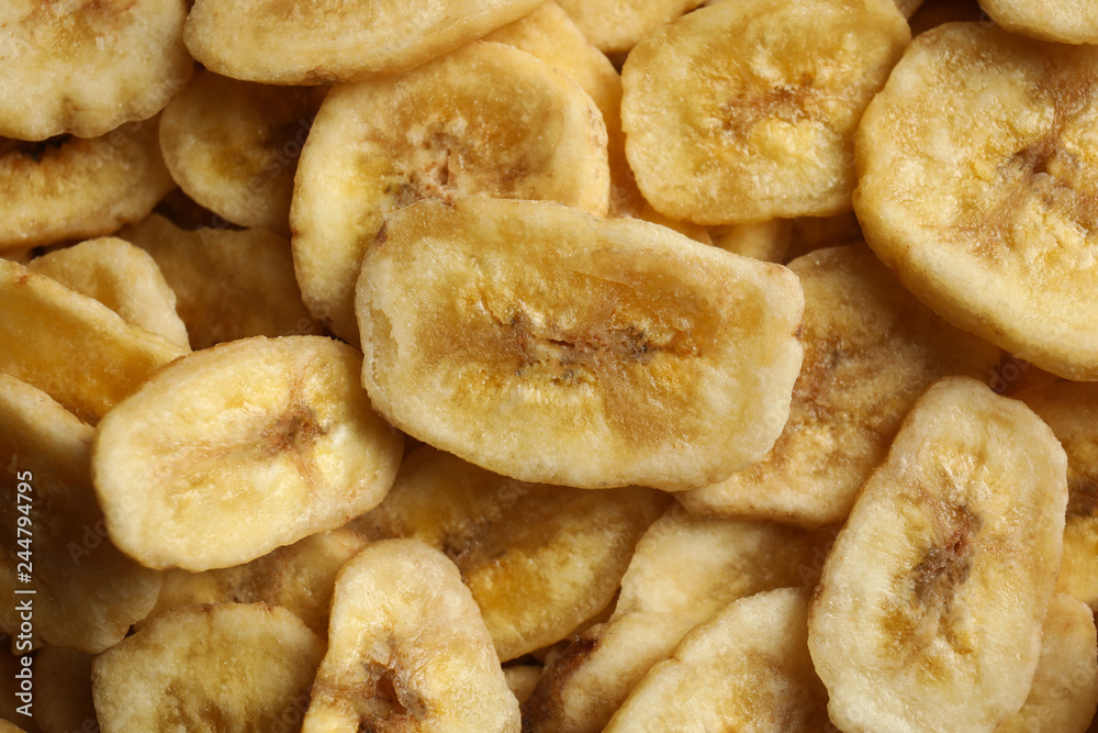 Sweet banana slices as background, top view. Dried fruit as healthy snack Sweet banana slices as background, top view. Dried fruit as healthy snack