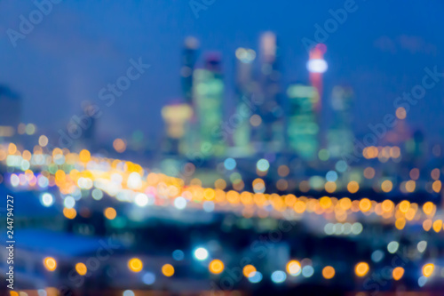 Defocused abstract image. Bokeh effect. Golden lights of the big city. Night city landscape, lights and Windows of houses.