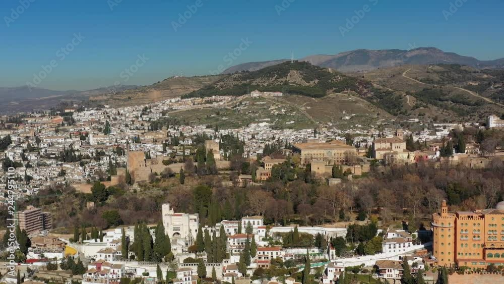 Aerial view of cityscape of Granada, famous historic city, monumental castle/palace complex of Alhambra - landscape panorama of Andalusia from above, Spain, Europe Aerial view of cityscape of Granada, famous historic city, monumental castle/palace complex of Alhambra - landscape panorama of Andalusia from above, Spain, Europe
