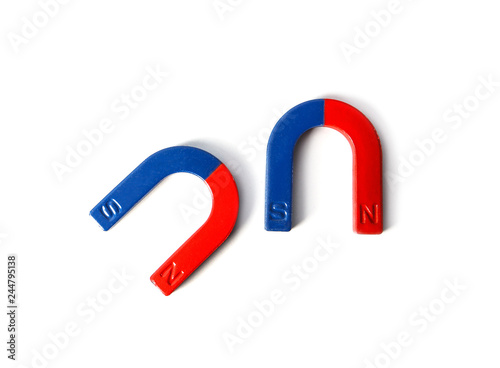 Red and blue horseshoe magnets isolated on white, top view