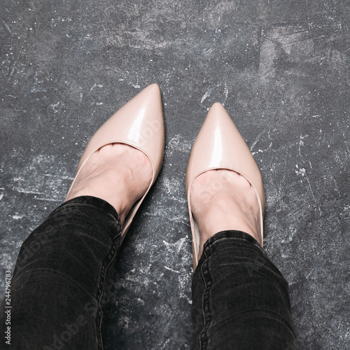 Women's feet in high heel shoes. POV style