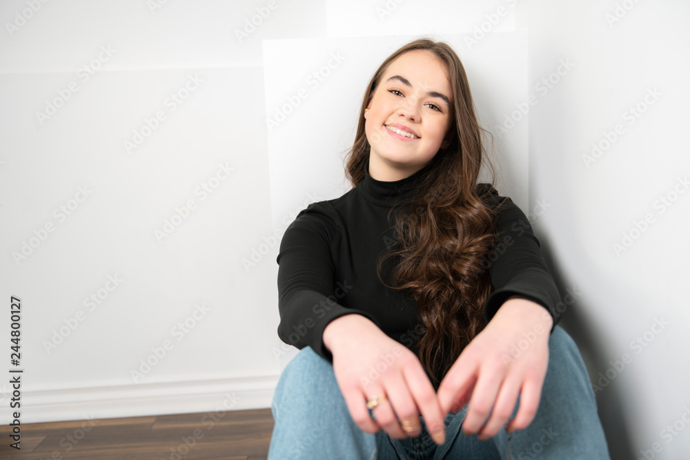 Portrait of a charming brunette little girl sit on white background Portrait of a charming brunette little girl sit on white background