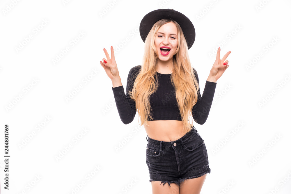 Close-up portrait of pretty blonde girl in black hat showing peace gesture and looking at camera, isolated on white background Close-up portrait of pretty blonde girl in black hat showing peace gesture and looking at camera, isolated on white background