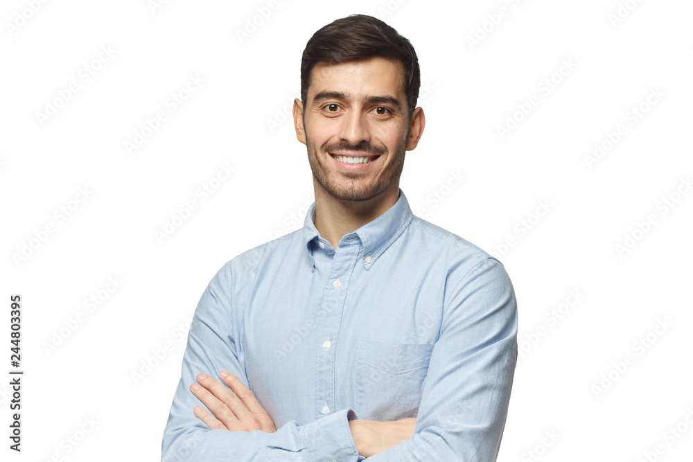 Modern businessman in blue shirt standing with crossed arms, isolated on white background - obrazy, fototapety, plakaty 