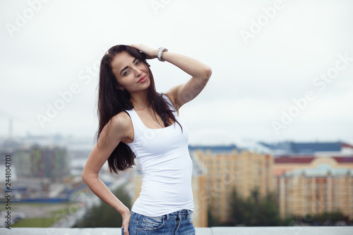 Amazing brunette girl posing at the roof © Alexey Tsyganov