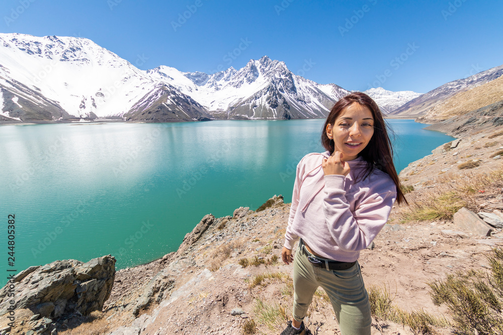 Girl looking at the amazing mountain views of the turquoise waters from the 