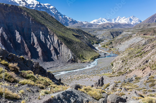 Andes valleys inside central Chile at Cajon del Maipo, Chile, amazing views over mountains, rivers and glaciers a perfect place for travel destination, hiking having some adventure on a remote place