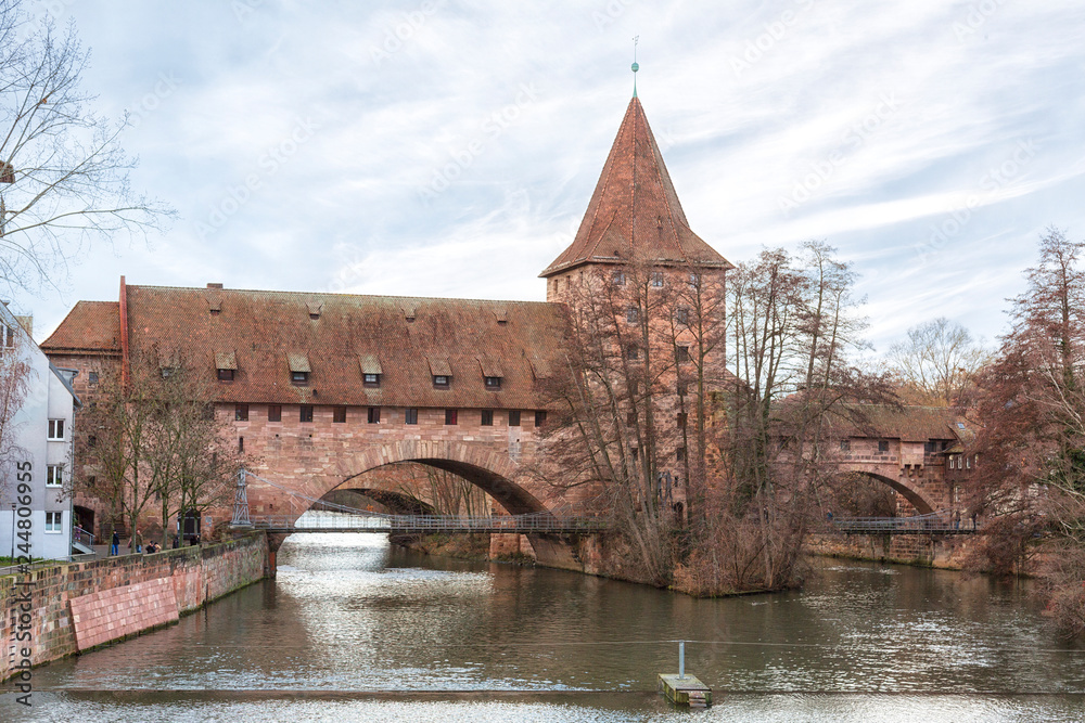 Nuremberg city, Germany - Schlayerturm medieval tower and Kettensteg (Chain Bridge) in winter