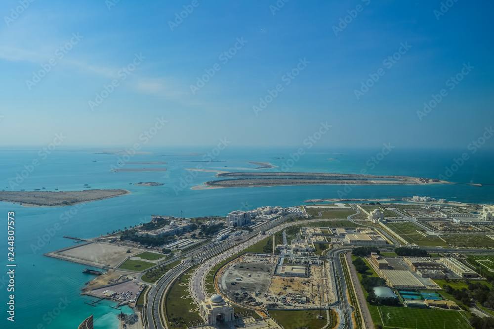Fototapeta premium Bird's eye and aerial drone view of Abu Dhabi city from observation deck