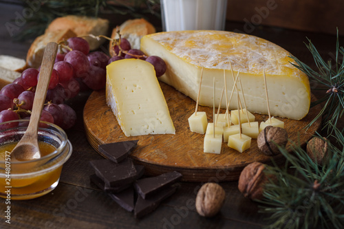 Сheese still life on wooden table