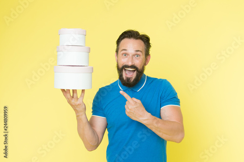 Prepared for holidays. Man mature bearded guy hold pile of gift boxes. Bought gifts for whole family. Birthday gift concept. Make surprise buy presents in advance. Holiday celebration. Get more bonus