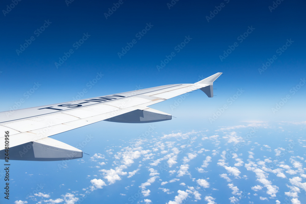 Fototapeta premium Aircraft Wing on blue sky background, Mediterranean Sea