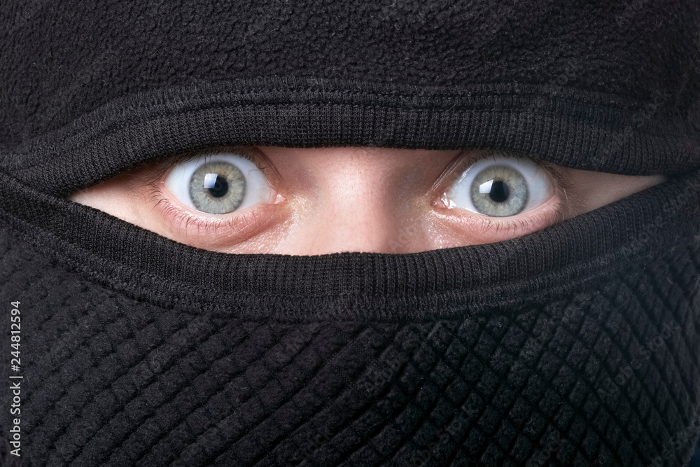 closeup portrait of the criminal in balaclava closeup portrait of the criminal in balaclava